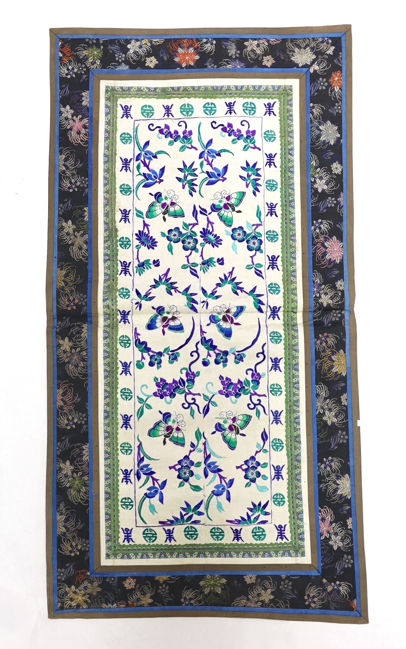 Three pairs of Chinese embroidered sleeve bands, polychrome silk designs on cream silk background, together with a single sleeve band, all bordered with damask silk, longest panel including border 66cm x 35cm wide